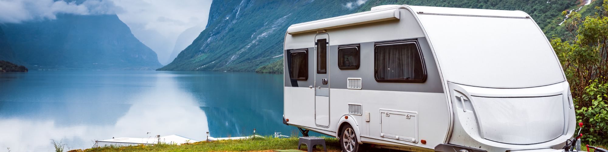 RV parked near a lake 